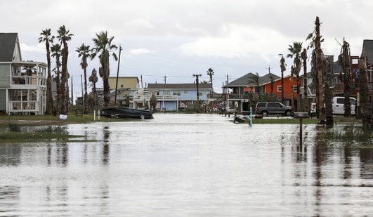 Streets are flooded from Hurricane Nicholas on Tuesday in Surfside Beach, Texas. (Jon Shepley/Houston Chronicle via AP)