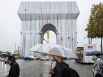 Masterpiece or monstrosity? Arc de Triomphe enveloped by Christo's artwork leaves tourists bemused Masterpiece or monstrosity? Arc de Triomphe enveloped by Christo's artwork leaves tourists bemused