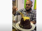 The image shows the man in the process of making the huge ice gola.(YouTube/Foodie Incarnate)