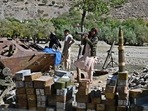 Taliban fighters stand next to ammunition along a road in Malaspa area, Bazark district in Panjshir province. Taliban fighters stand next to ammunition along a road in Malaspa area, Bazark district in Panjshir province.