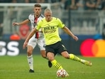 Besiktas' Francisco Montero, left, challenges for the ball with Dortmund's Erling Haaland during the Champions League Group C soccer match(AP) Besiktas' Francisco Montero, left, challenges for the ball with Dortmund's Erling Haaland during the Champions League Group C soccer match(AP)