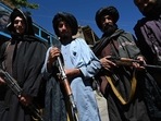 Taliban fighters pose for a picture in front of a bakery at a market area in Khenj district, Panjshir Province. Taliban fighters pose for a picture in front of a bakery at a market area in Khenj district, Panjshir Province.