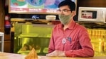 Mukti Ram Parajuli, manning the snack counter, is gearing up for the 10-minute interval that will begin shortly.(Mayank Austen Soofi) Mukti Ram Parajuli, manning the snack counter, is gearing up for the 10-minute interval that will begin shortly.(Mayank Austen Soofi)
