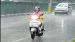 A scooterist braving the heavy showers at Madhya Marg in Chandigarh on Thursday. (Ravi Kumar/HT) A scooterist braving the heavy showers at Madhya Marg in Chandigarh on Thursday. (Ravi Kumar/HT)