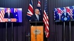 Australia's prime minister Scott Morrison appears on stage with video links to Britain's Prime Minister Boris Johnson, left, and U.S. President Joe Biden at a joint press conference at Parliament House in Canberra, on Thursday. (AP) Australia's prime minister Scott Morrison appears on stage with video links to Britain's Prime Minister Boris Johnson, left, and U.S. President Joe Biden at a joint press conference at Parliament House in Canberra, on Thursday. (AP)