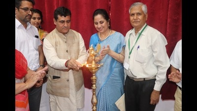 The lighting of the lamp ceremony in progress on Day 1 of the national conference on the role of yoga and naturopathy in the management of post Covid symptoms being held at Government College of Yoga Education and Health in Chandigarh. (HT photo)
