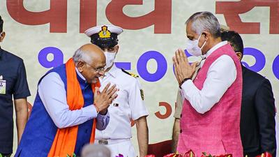 Gujarat chief minister Bhupendra Patel greets Gujarat governor Acharya Devvrat during the state ministerial cabinet swearing-in ceremony in Gandhinagar on Thursday. (PTI) Gujarat chief minister Bhupendra Patel greets Gujarat governor Acharya Devvrat during the state ministerial cabinet swearing-in ceremony in Gandhinagar on Thursday. (PTI)