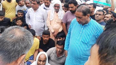 Dadri MLA Tejpal Nagar (in blue) met the woman’s family in Sadopur village of Greater Noida on Thursday. (Sourced) Dadri MLA Tejpal Nagar (in blue) met the woman’s family in Sadopur village of Greater Noida on Thursday. (Sourced)