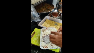 The image shows a man putting cheese on ice cream chaat. (Instagram/@streetfoodrecipe)