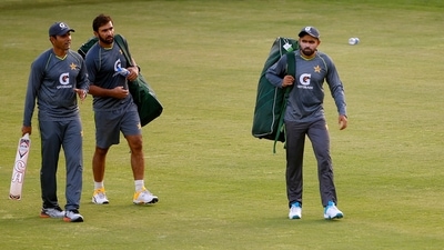 Pakistan's skipper Babar Azam, right, Iftikhar Ahmed, center, and blowing coach Abdul Razzaq arrive for a training session in the Pindi Cricket Stadium, in Rawalpindi, Pakistan, Monday, Sept. 13, 2021. Pakistan will play first ODI match against New Zealand on Sept. 17 in Rawalpindi. (AP) Pakistan's skipper Babar Azam, right, Iftikhar Ahmed, center, and blowing coach Abdul Razzaq arrive for a training session in the Pindi Cricket Stadium, in Rawalpindi, Pakistan, Monday, Sept. 13, 2021. Pakistan will play first ODI match against New Zealand on Sept. 17 in Rawalpindi. (AP)