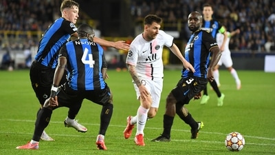Paris St Germain's Lionel Messi in action with Club Brugge's Eder Balanta and Stanley N'Soki (REUTERS)