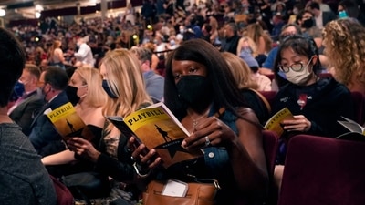 People wait in the audience at the Broadway musical 'Hamilton' as the highest grossing Broadway musical of all time returns after 18 months in the dark due the coronavirus pandemic. (AFP) People wait in the audience at the Broadway musical 'Hamilton' as the highest grossing Broadway musical of all time returns after 18 months in the dark due the coronavirus pandemic. (AFP)