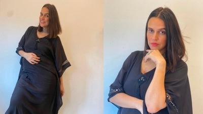 Neha Dhupia accessorised her look with a silver choker and huge rings. (Instagram/@gumanistylists)