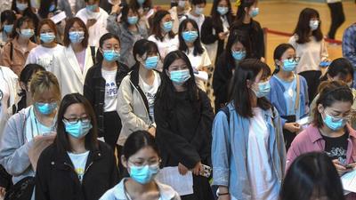 University students queueing to receive the China National Biotec Group Covid-19 vaccine at a university in Wuhan in China’s central Hubei province. China has fully vaccinated over 1 billion people - 70% of its 1.4 billion population - a health official said on Thursday. (AFP)