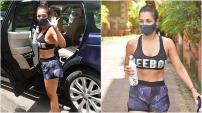 Keeping things fuss-free, Malaika tied her locks in a sleeked back top bun with the gym look. She completed her ensemble with a pair of pink flip flops and a printed face mask to stay safe during the Covid-19 pandemic. (HT Photo/Varinder Chawla)