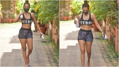 Malaika teamed the bra top with a pair of workout shorts, featuring the most playful multi-coloured pattern on them. The mix-and-matched shades added up to create a soothing colour palette. (HT Photo/Varinder Chawla)