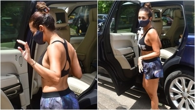 Today, Malaika was snapped outside her yoga studio, flaunting her midriff, in a black printed sports bra from Reebok. The sleeveless sports bra featured a scooped neckline, the brand's name printed on the front, and racerback detail. (HT Photo/Varinder Chawla) Today, Malaika was snapped outside her yoga studio, flaunting her midriff, in a black printed sports bra from Reebok. The sleeveless sports bra featured a scooped neckline, the brand's name printed on the front, and racerback detail. (HT Photo/Varinder Chawla)