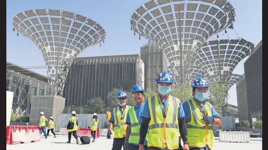 Technicians walk at the under construction site of the Expo 2020 in Dubai, United Arab Emirates. (File photo)