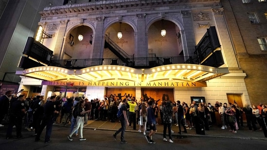 People wait to attend the Broadway musical ‘Hamilton’ after showing their vaccination cardsat the Richard Rodgers Theatre in New York, as the highest grossing Broadway musical of all time returns after being dark for 18 months due the coronavirus pandemic.&nbsp;(AFP)