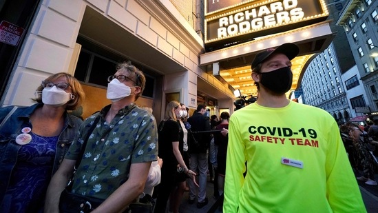 People wait to attend the Broadway musical ‘Hamilton’ after showing their vaccination cards at the Richard Rodgers Theatre in New York.(AFP)