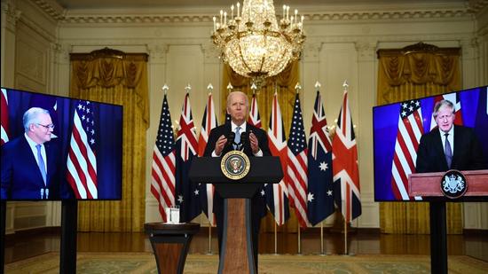 US President Joe Biden participates in a virtual press conference on national security with British Prime Minister Boris Johnson (R) and Australian Prime Minister Scott Morrison in the East Room of the White House in Washington on Wednesday. (AFP) US President Joe Biden participates in a virtual press conference on national security with British Prime Minister Boris Johnson (R) and Australian Prime Minister Scott Morrison in the East Room of the White House in Washington on Wednesday. (AFP)