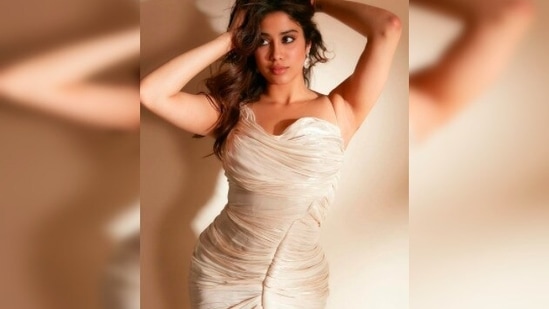 Janhvi Kapoor is feeling all "vanilla swirlie" as she poses in nude bodycon dress.(Instagram/@janhvikapoor)