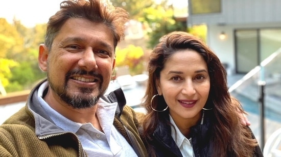 Madhuri Dixit poses with her husband, Dr Shriram Nene.