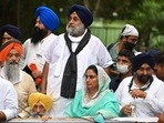 SAD president Sukhbir Singh Badal and party member Harsimrat Kaur Badal bottom) take part in a protest march against the farm laws.&nbsp;