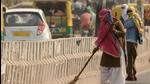 MCG sanitation workers cleaning the road in Gurugram. (HT File) MCG sanitation workers cleaning the road in Gurugram. (HT File)