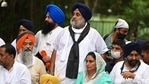 SAD president Sukhbir Singh Badal and party member Harsimrat Kaur Badal bottom) take part in a protest march against the farm laws. (AFP Photo) SAD president Sukhbir Singh Badal and party member Harsimrat Kaur Badal bottom) take part in a protest march against the farm laws. (AFP Photo)