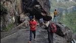 People crossing the boulders which blocked the NH-5 after a massive landslide at Chaura in Kinnaur, HP, on Friday. (HT Photo) People crossing the boulders which blocked the NH-5 after a massive landslide at Chaura in Kinnaur, HP, on Friday. (HT Photo)