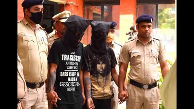 The accused, a cook and a car washer, in police custody in Chandigarh on Friday. (HT Photo) The accused, a cook and a car washer, in police custody in Chandigarh on Friday. (HT Photo)