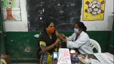 A person being vaccinated against Covid-19 at primary school Sector 31, in Noida. (Sunil Ghosh/HT Photo)