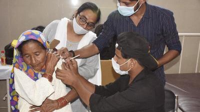 A health worker administers a dose of Covid-19 vaccine, at a healthcare facility in Ghaziabad’s Dasna on Friday. The district on Friday operated the mega drive with 165 vaccination centres. (SAKIB ALI/HT PHOTO) A health worker administers a dose of Covid-19 vaccine, at a healthcare facility in Ghaziabad’s Dasna on Friday. The district on Friday operated the mega drive with 165 vaccination centres. (SAKIB ALI/HT PHOTO)