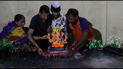 Devotees immerse Ganesh idol in an artificial pond made by Ambika Mitra Mandal, Ulhasnagar. (Rishikesh Choudhary/HT Photo) Devotees immerse Ganesh idol in an artificial pond made by Ambika Mitra Mandal, Ulhasnagar. (Rishikesh Choudhary/HT Photo)