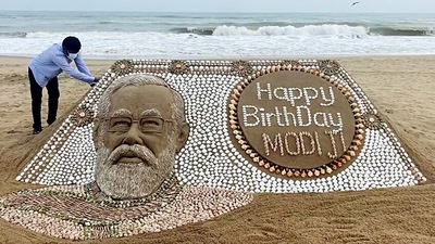 Sand artist Sudarsan Pattnaik extends his wishes by creating a sand sculpture of Prime Minister Narendra Modi on his 71st birthday, in Puri. (ANI) Sand artist Sudarsan Pattnaik extends his wishes by creating a sand sculpture of Prime Minister Narendra Modi on his 71st birthday, in Puri. (ANI)