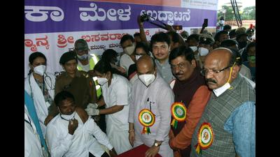 A beneficiary receives a dose of the Covid-19 vaccine during the inauguration of a massive vaccination drive by Karnataka chief minister Basavaraj Bommai, in Gulbarga on Friday. (ANI)