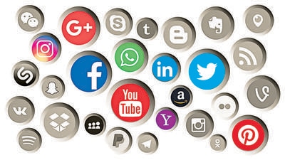 Collection of popular social media logos printed on paper: Facebook; Twitter; LinkedIn; Instagram; WhatsApp; Youtube; Blogger and others (Shutterstock)