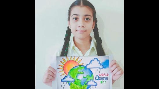 A student of Green Grove Public School, Ludhiana, showcasing a poster made by her. (HT Photo)