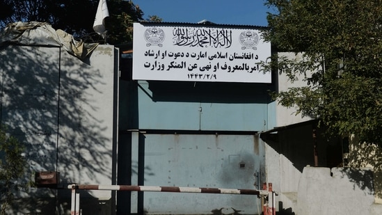 A sign of the Ministry for the Promotion of Virtue and Prevention of Vice, which replaced the Ministry for Women's Affairs, is seen at an entrance gate of a government building in Kabul.(AFP)
