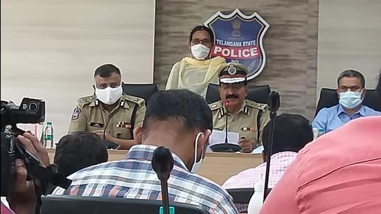 Sammakka, who was a Khammam district committee member operating from the bordering forests of Chhattisgarh, had a reward of ₹5 lakh on her head. Director General of Police M Mahendar Reddy, before whom she surrendered, handed over the cheque to her. (HT PHOTO.)