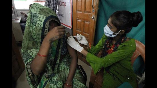 A beneficiary receives a dose of the Covid-19 vaccine during a vaccination drive on the occasion of Prime Minister Narendra Modi’s 71st Birthday, in Gomti Nagar area of Lucknow on Friday (ANI Photo)