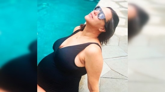 Sharing the pictures of herself in a bold black swimsuit, Neha Dhupia captioned it, "Pool party for two."(Instagram/@nehadhupia)