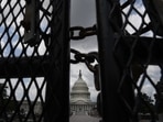 The black fence that surrounded the US Capitol building for six months following the January 6 riots has been brought back ahead of the rally along with surveillance cameras.(AFP) The black fence that surrounded the US Capitol building for six months following the January 6 riots has been brought back ahead of the rally along with surveillance cameras.(AFP)