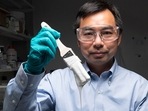 Xiulin Ruan, a Purdue University professor of mechanical engineering, and his students have created the whitest paint in the world. (Purdue University photo/John Underwood) Xiulin Ruan, a Purdue University professor of mechanical engineering, and his students have created the whitest paint in the world. (Purdue University photo/John Underwood)