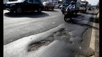 Motorists negotiate through potholes on Nerul flyover as resurfacing of flyovers on Sion-Panvel Highway not done before monsoon. (BACHCHAN KUMAR/HT) Motorists negotiate through potholes on Nerul flyover as resurfacing of flyovers on Sion-Panvel Highway not done before monsoon. (BACHCHAN KUMAR/HT)