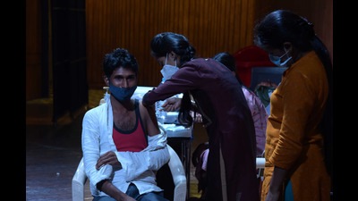 A beneficiary gets vaccinated with his first dose at Vishnudas Bhave auditorium in Vashi on Saturday during NMMC’s drive. (BACHCHAN KUMAR/HT PHOTO) A beneficiary gets vaccinated with his first dose at Vishnudas Bhave auditorium in Vashi on Saturday during NMMC’s drive. (BACHCHAN KUMAR/HT PHOTO)