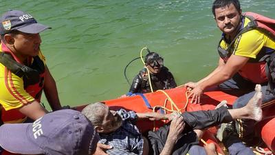 SDRF personnel during the search operation at Tehri Lake on Saturday. (HT PHOTO.) SDRF personnel during the search operation at Tehri Lake on Saturday. (HT PHOTO.)
