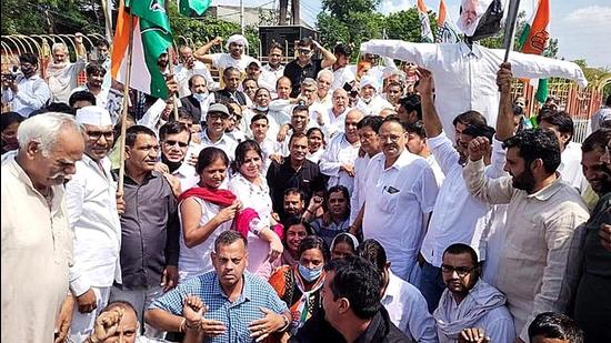 Congress workers staging a demonstration against the BJP at Rohtak on Saturday. (Manoj Dhaka/HT)