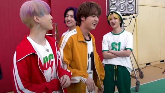 BTS members Jin, Jimin and Jungkook goof around while J-Hope watches.&nbsp;